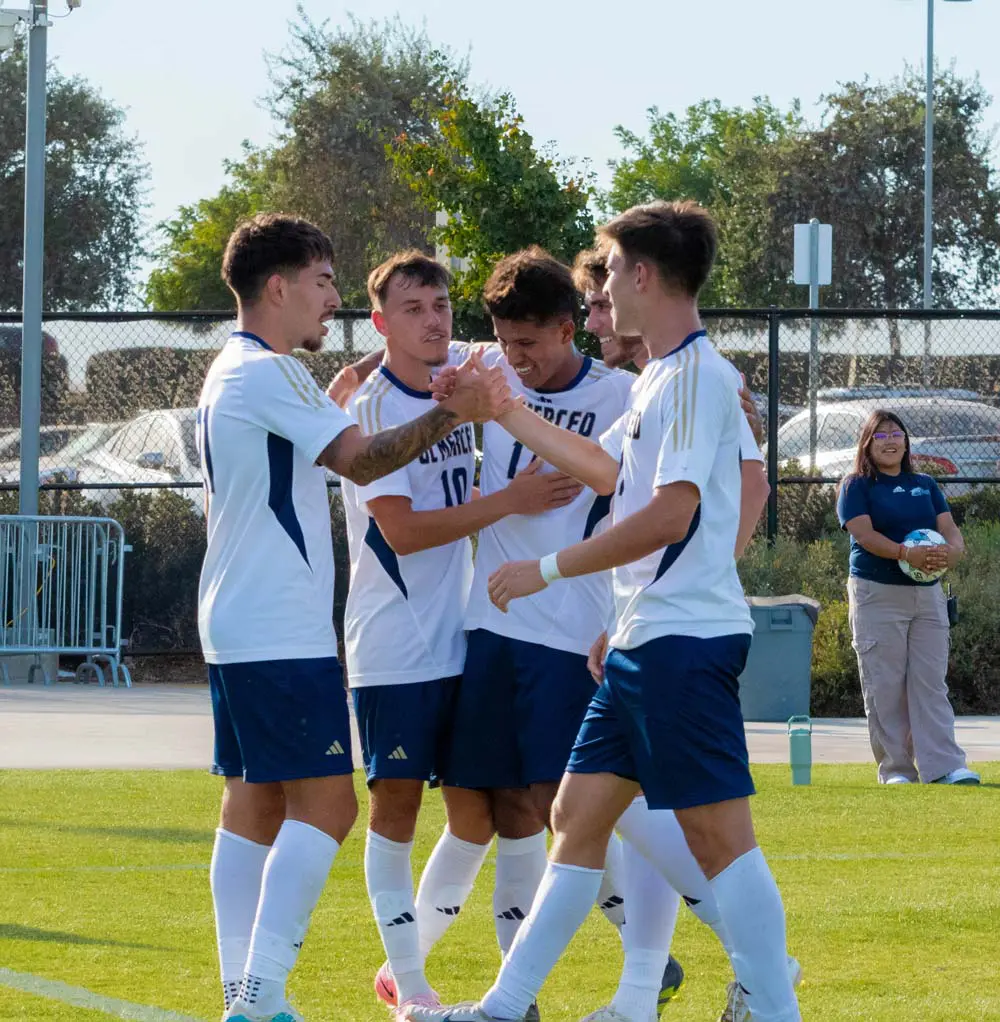 Soccer players high-fiving