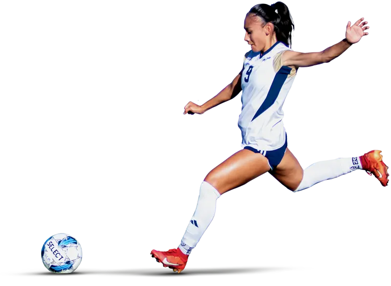 woman getting ready to kick a soccer ball