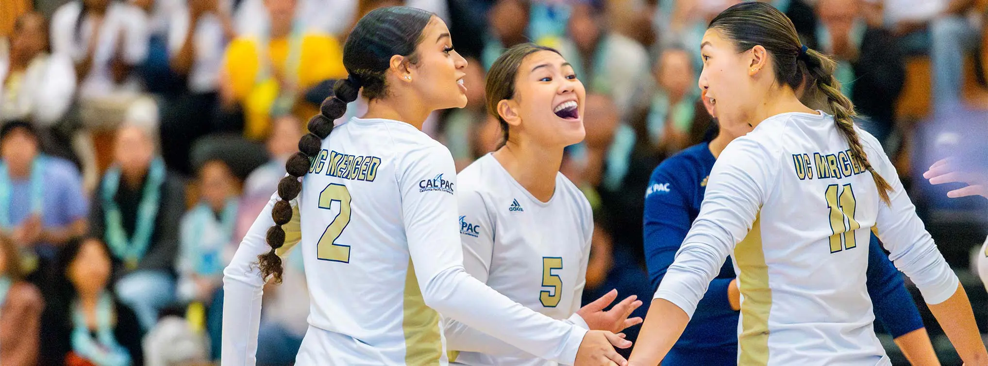Female athletes smiling at each other